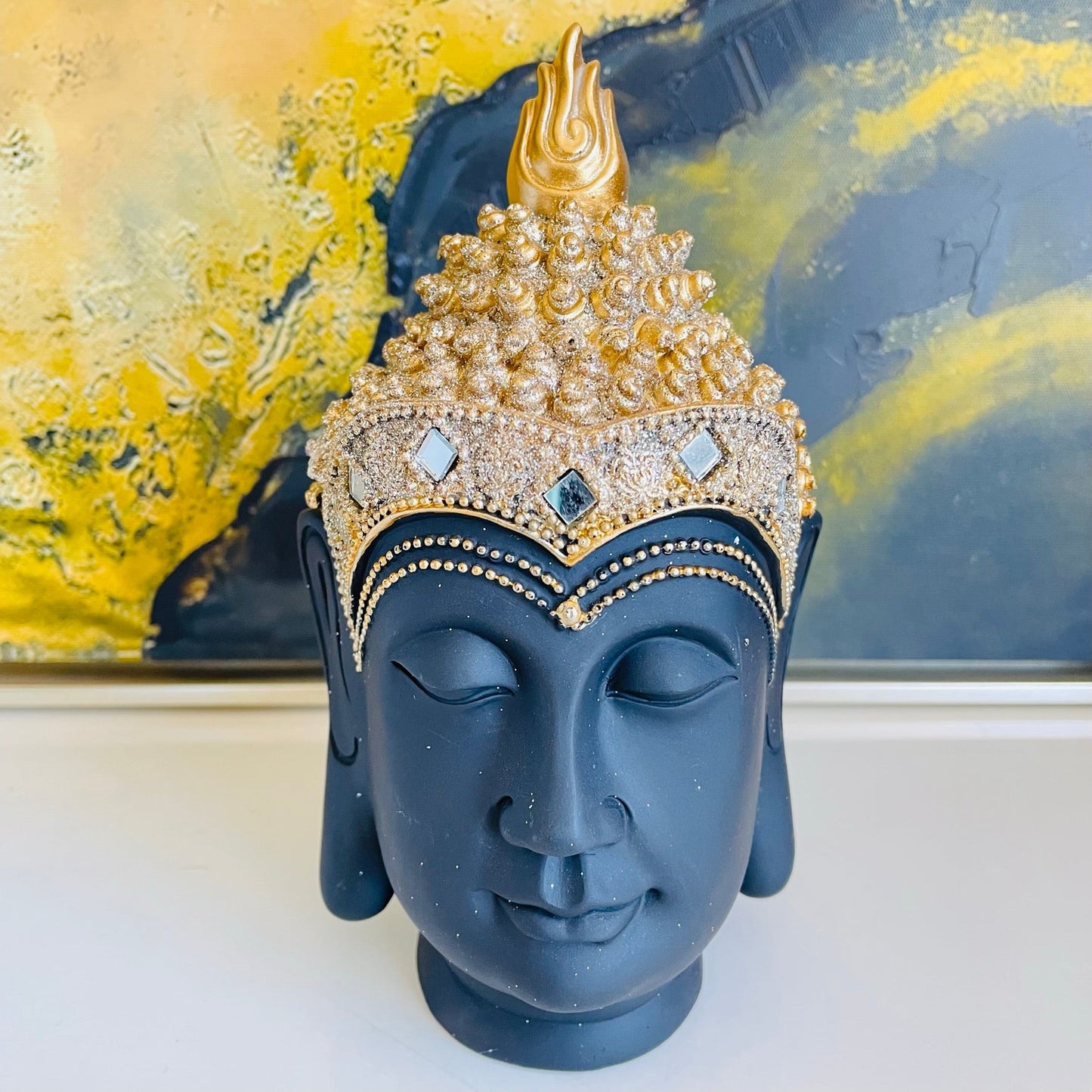 Cabeza de buda negro y dorado