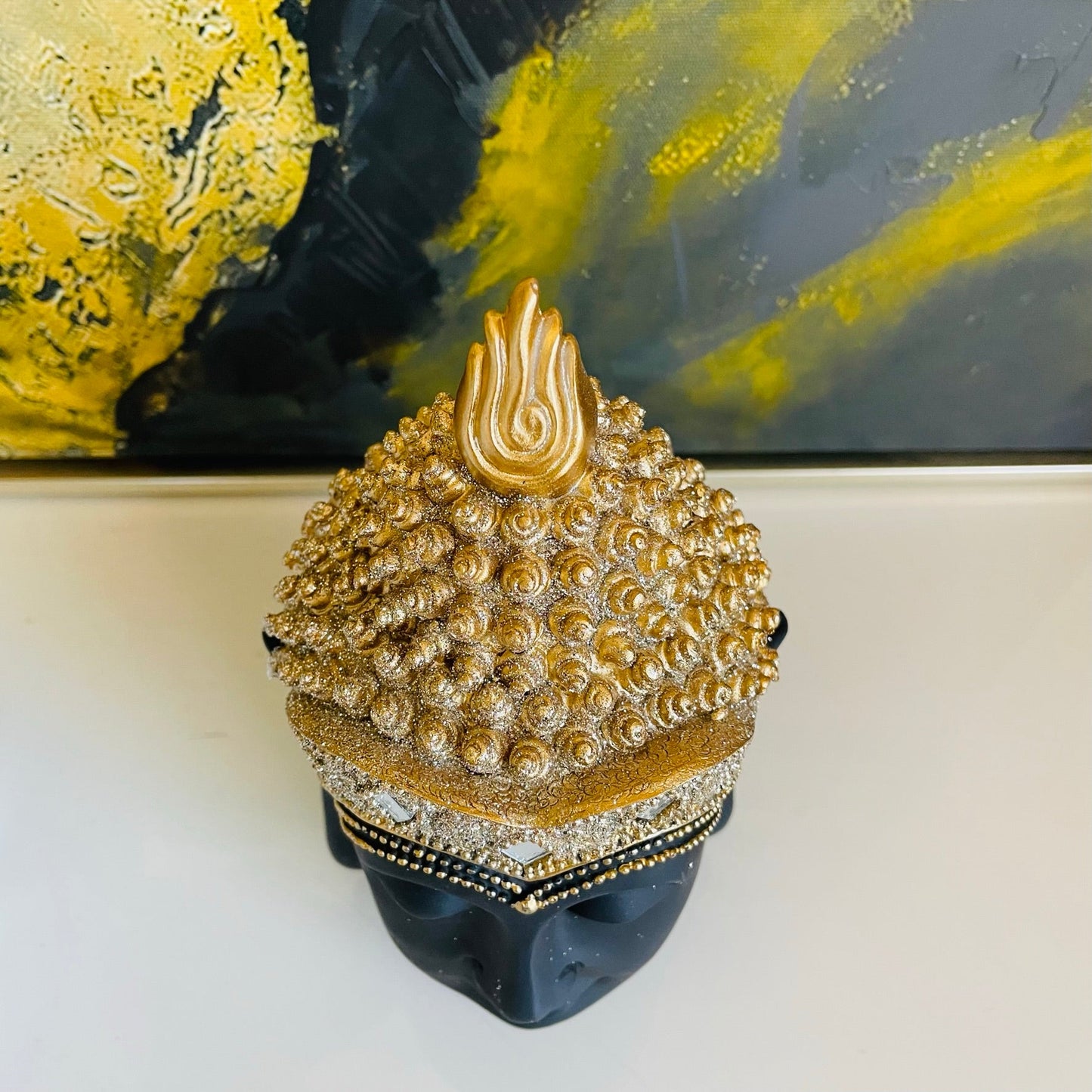 Cabeza de buda negro y dorado