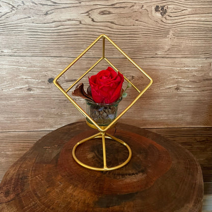 Rosa eterna con soporte dorado